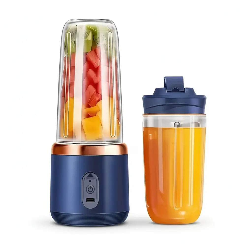 Portable blender with a shaker filled with orange juice on a white background