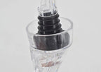 Wine pourer aerator with stacked black rings and clear base reservoir