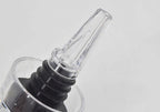 Clear aerator spout with black ring and threaded collar, angled nozzle end