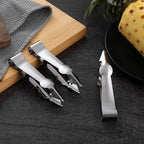 Stainless steel V-shaped fruit huller tweezers set beside spare blade and handle