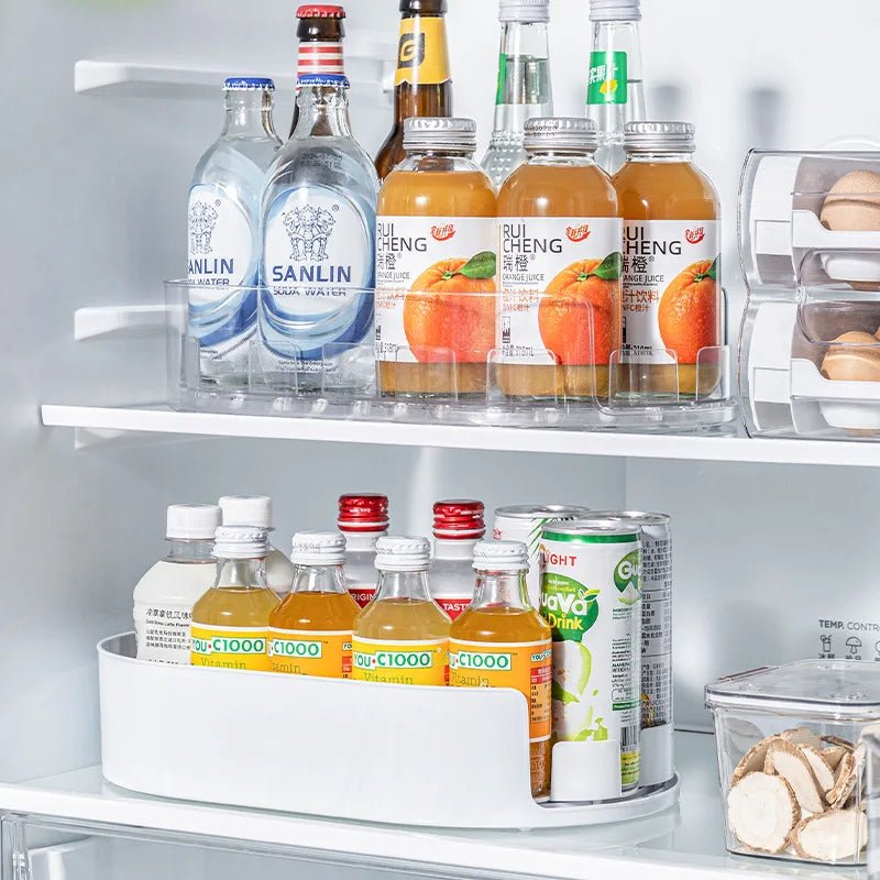 Oval refrigerator turntable with clear bottle slots for drinks and condiments