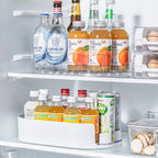 Oval refrigerator turntable with clear bottle slots for drinks and condiments