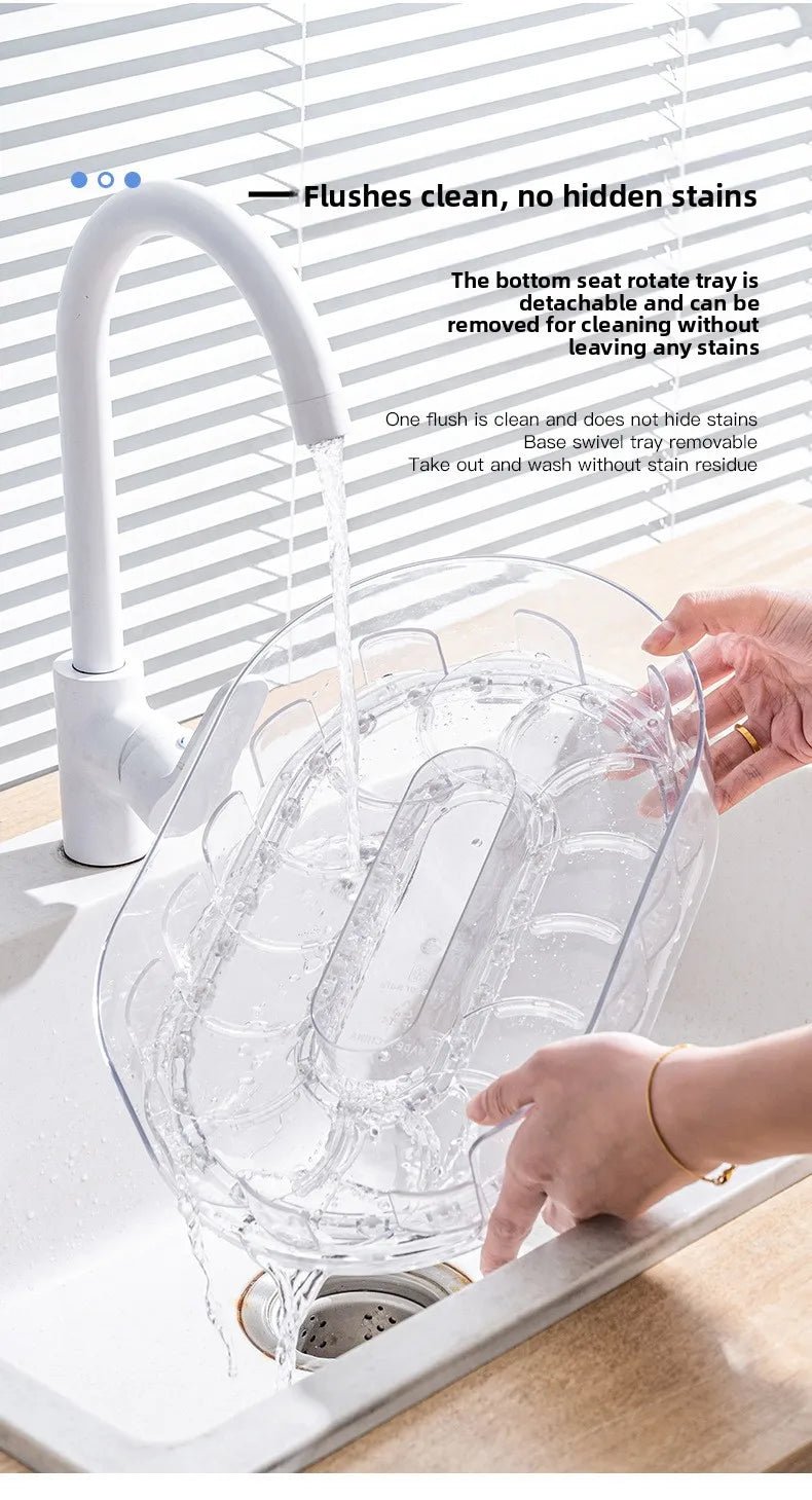 Clear oval turntable rinsed in sink, showing 360° bottle storage slots