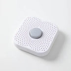 White refrigerator deodorizer box with perforated surface and gray date button