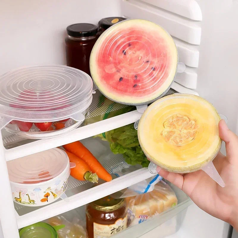 Set of silicone stretch lids in clear and pastel colors on refrigerator shelves