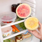 Set of silicone stretch lids in clear and pastel colors on refrigerator shelves