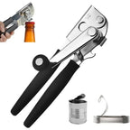 Manual can opener with black grips and chrome cutting wheel, shown with can pieces