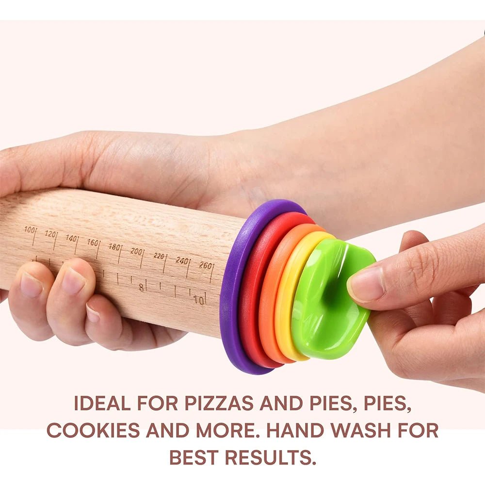 Close-up of hands gripping a beech rolling pin with colorful thickness rings