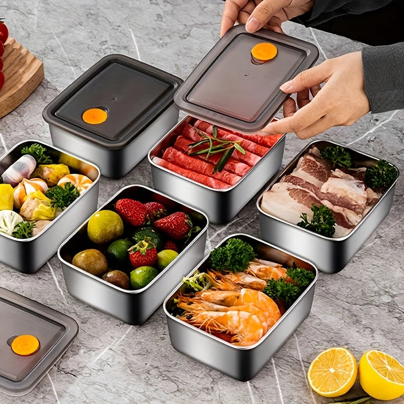 Stainless steel meal prep containers with vented lids open, holding ready-to-eat food