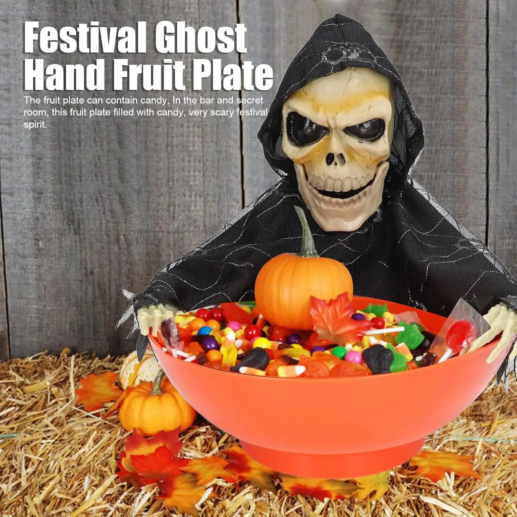 Orange skull bowl haunted prop with hooded skeleton, filled with colorful candy