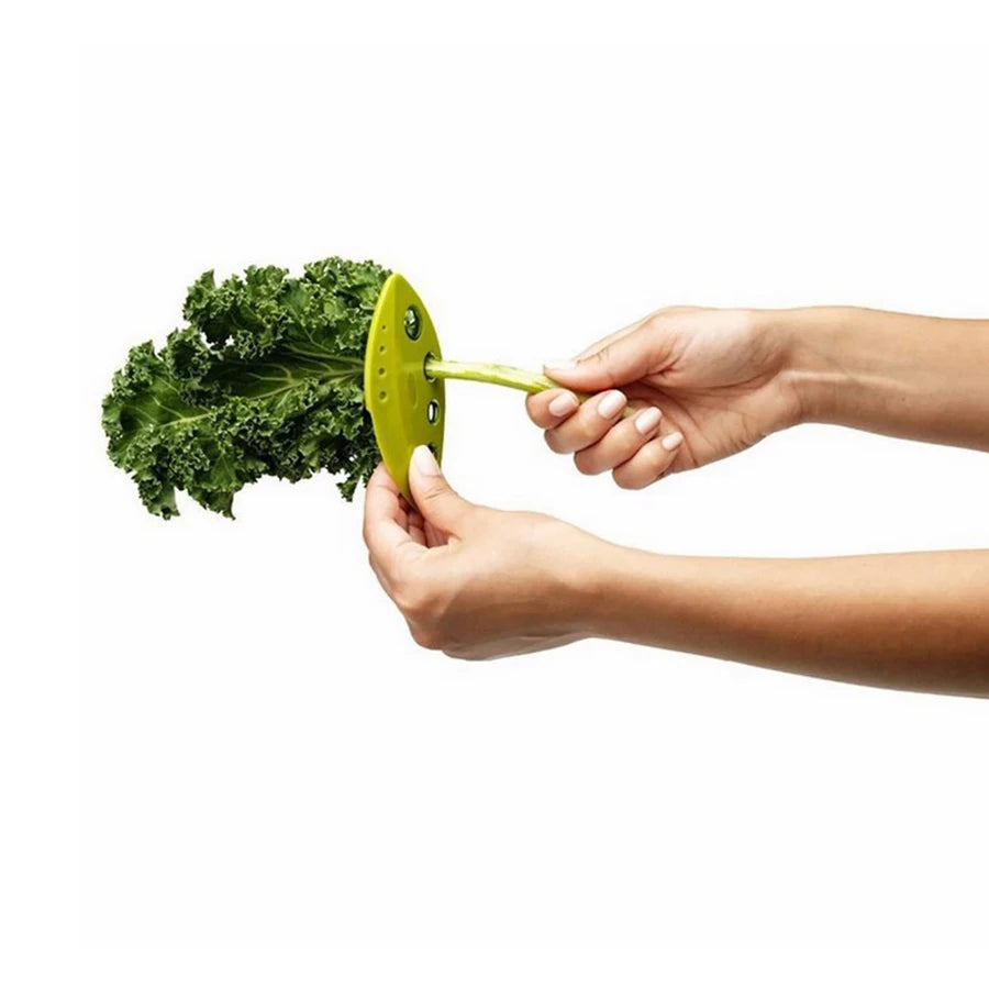 Yellow herb leaf stripper held in hands, showing curved blade and 8-hole head