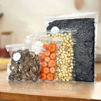 Reusable vacuum sealer storage bags with valves, packed with assorted dry beans and food