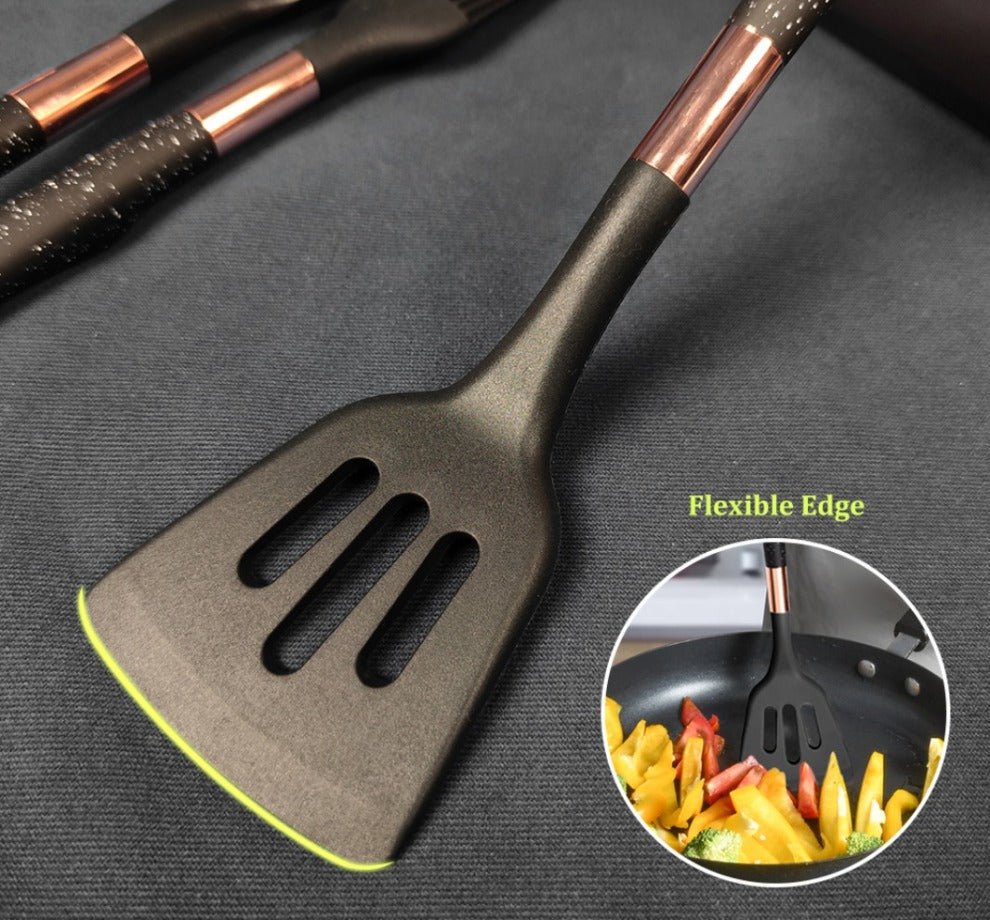 Black silicone spatula with rose-gold handle, flexible edge detail close-up
