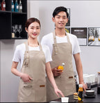 Khaki tan waterproof canvas chef apron with front pockets and adjustable neck