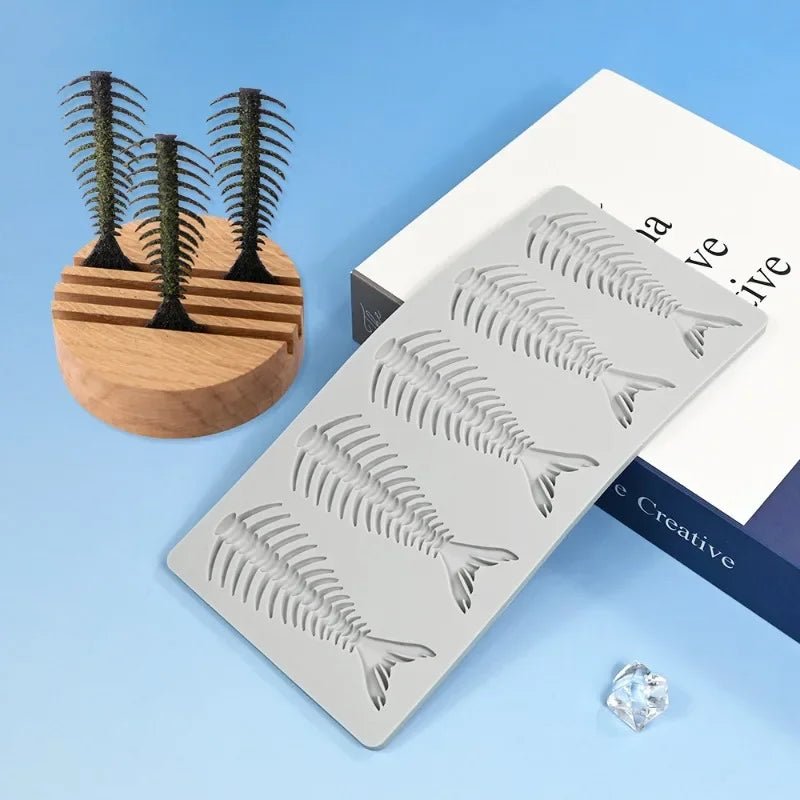 Silicone fishbone cake border mold sheets on white packaging with molded rows