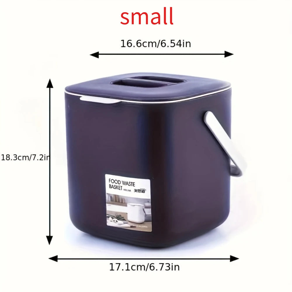 Small dark purple countertop food waste bin with hinged lid and side carry handle
