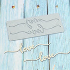 Silicone cake border mold with curving love script and bone accents