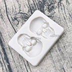 Skull silicone cake mold with two raised skull cavities and detailed facial features