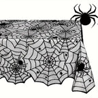 Black spider-web lace table runner corner close-up with spider and web motifs