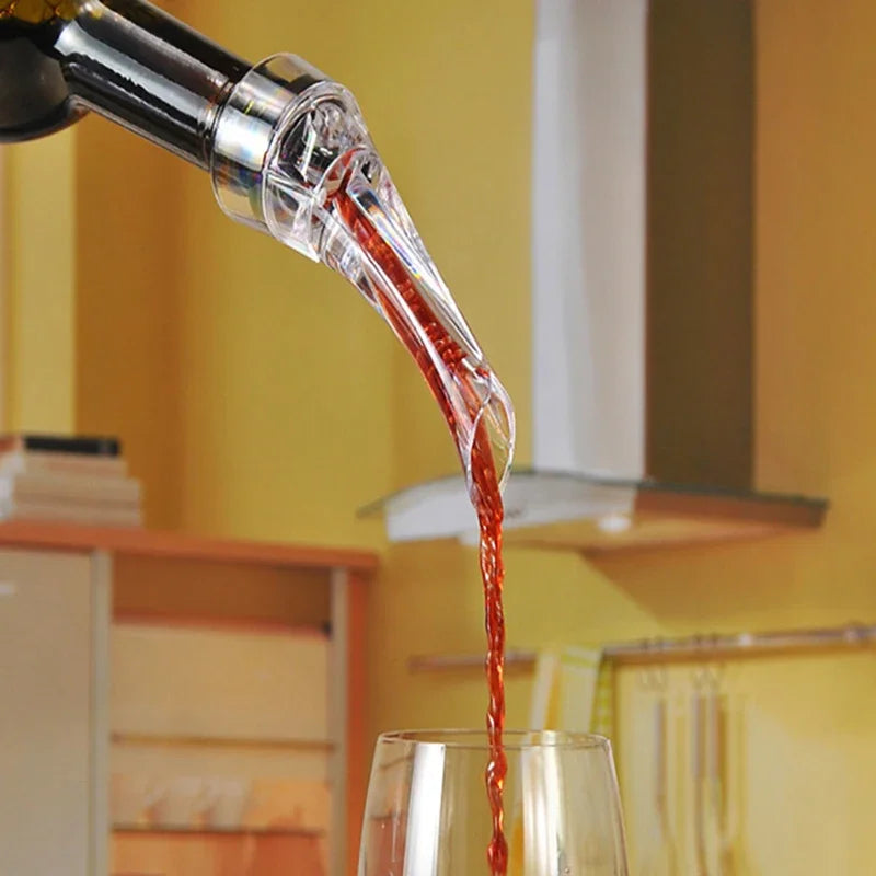 Wine aerator pourer spout releasing red wine stream from clear outlet