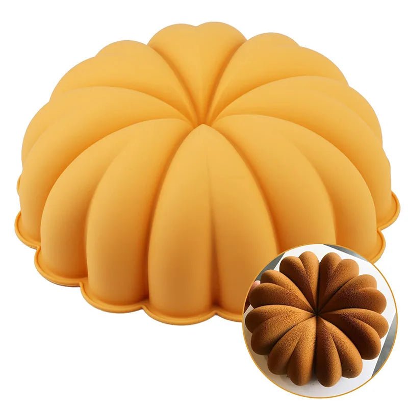 Pumpkin-shaped silicone cake pan with scalloped ridges, orange-yellow