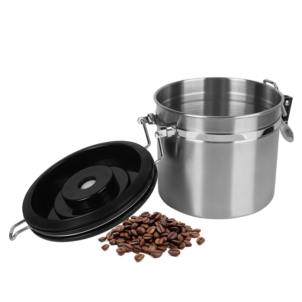 Stainless steel coffee storage canister with black lid, valve cap, and coffee beans