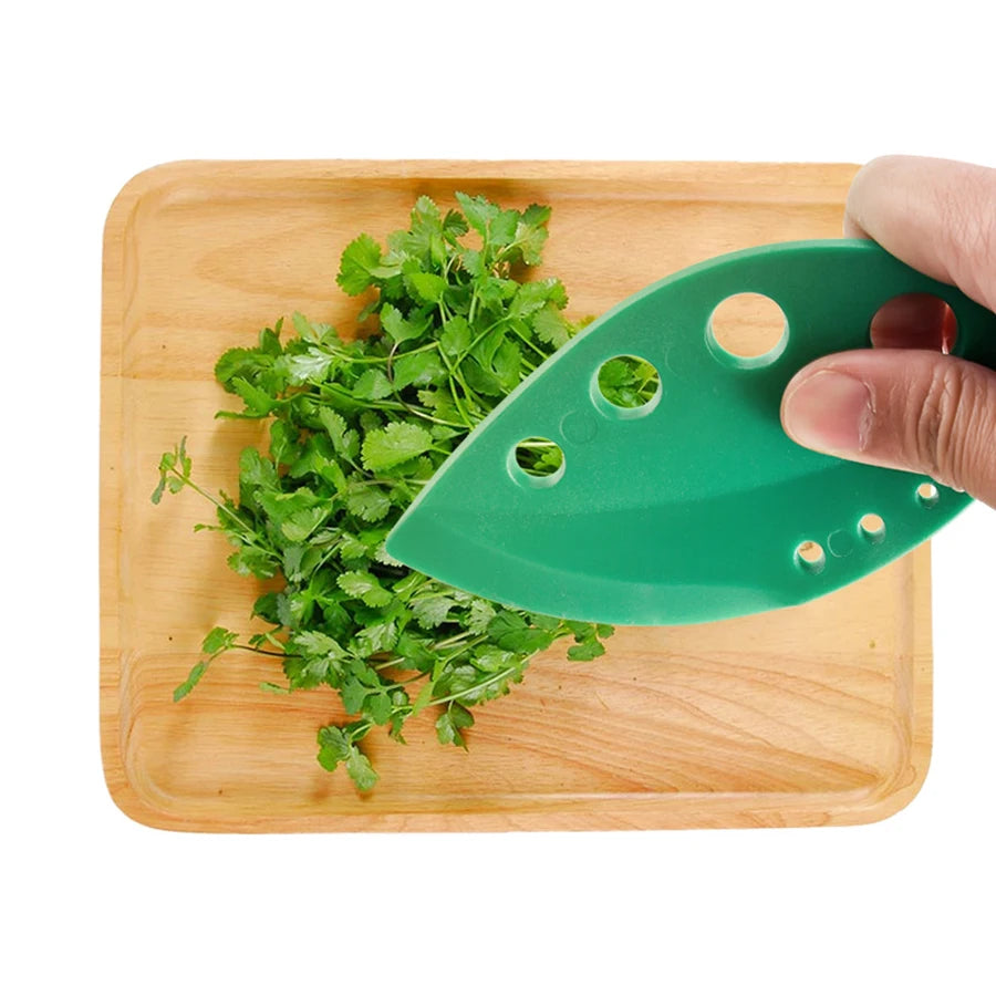 Green herb leaf stripper tool with curved cutting blade and 8-hole perforations