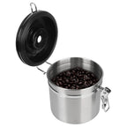Stainless steel coffee storage canister with black lid and coffee beans, hinged on side