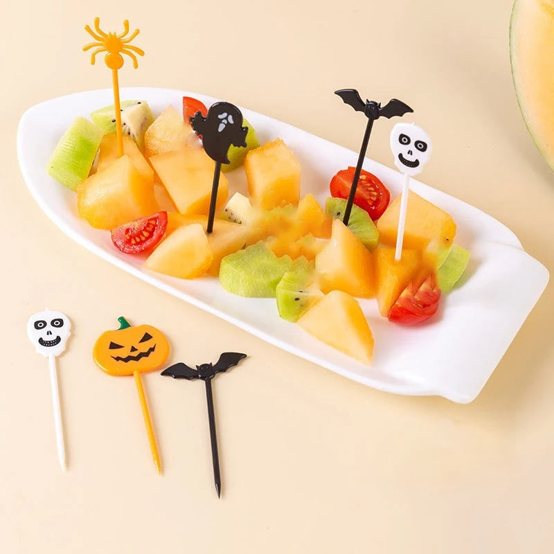 Plastic Halloween cupcake toppers with pumpkin, ghost, bat, and spider designs on sticks