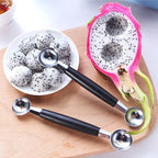 Black-handled stainless steel fruit baller tool with two round scoop ends on board