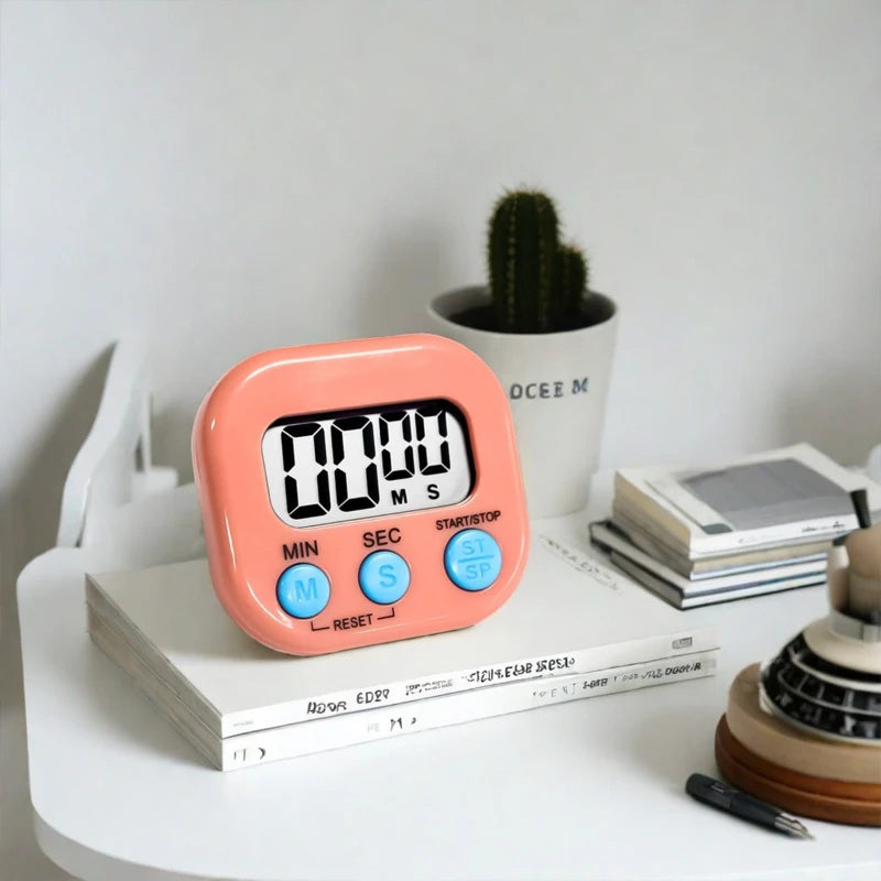 Pink digital kitchen timer with large LCD display and round MIN/SEC start/stop buttons