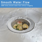 Stainless steel sink strainer basket holding food scraps over a drain