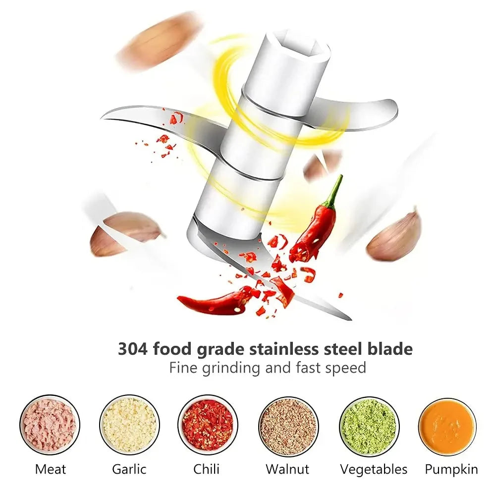 Electric mini chopper with stainless steel blade, showing chili and garlic ingredients flying.