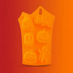 Orange Halloween-themed silicone mold shaped like a tote bag with embossed jack-o-lantern pumpkin faces and ghost designs on an orange-red gradient background.