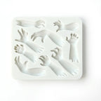 White silicone Halloween mold with multiple zombie hand and arm shapes on white background.
