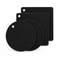 Black silicone trivet mats set with hex texture, stacked pads, and hanging holes