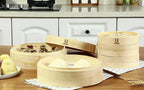 3-tier natural bamboo steamer basket set with lids, stacked on countertop