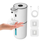 White touchless automatic soap sanitizer dispenser dispensing foam; hand at nozzle