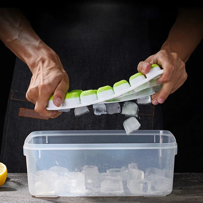 Ice cube tray with clear lid; mint green silicone tray; lid opening with hands