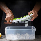 Ice cube tray with clear lid; mint green silicone tray; lid opening with hands