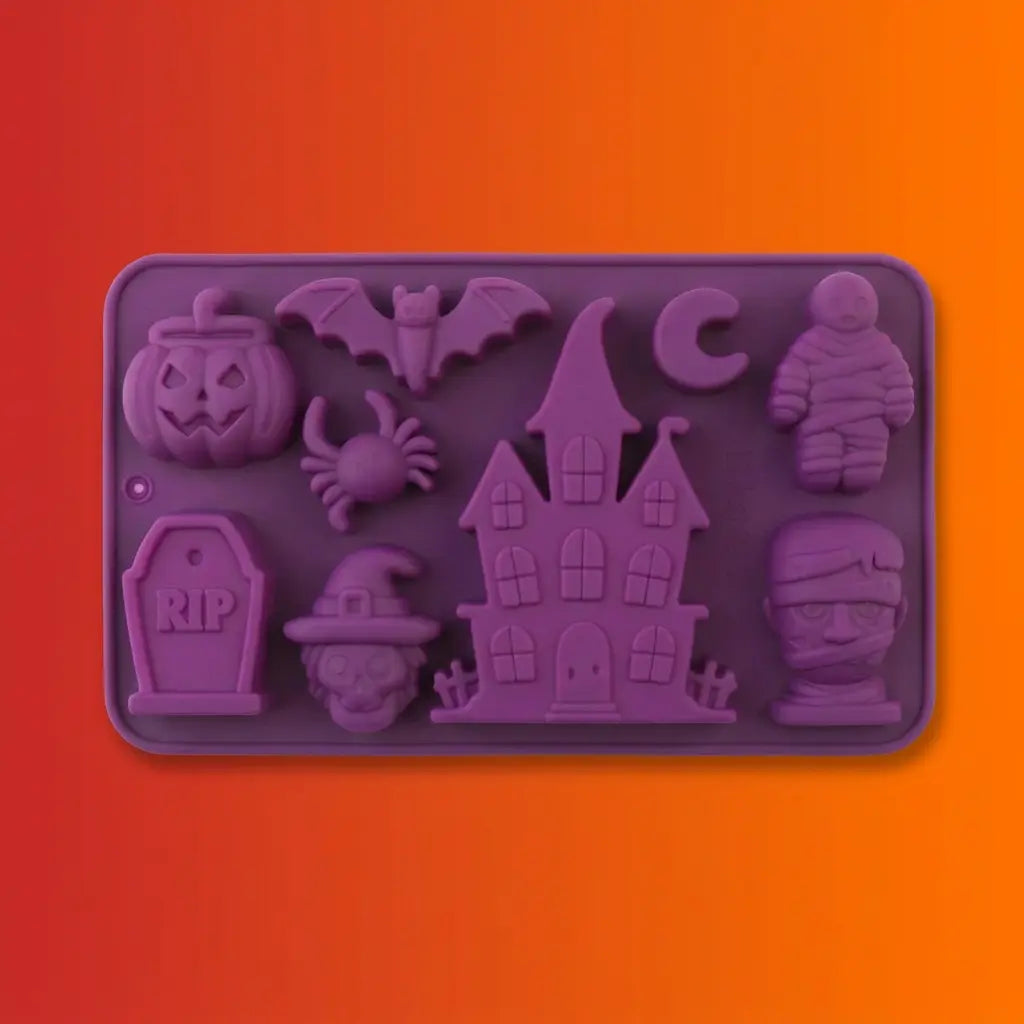 Purple Halloween-themed silicone baking mold with pumpkin, bat, spider, crescent moon, mummy, haunted house, RIP tombstone, witch, and skull shapes on orange background.