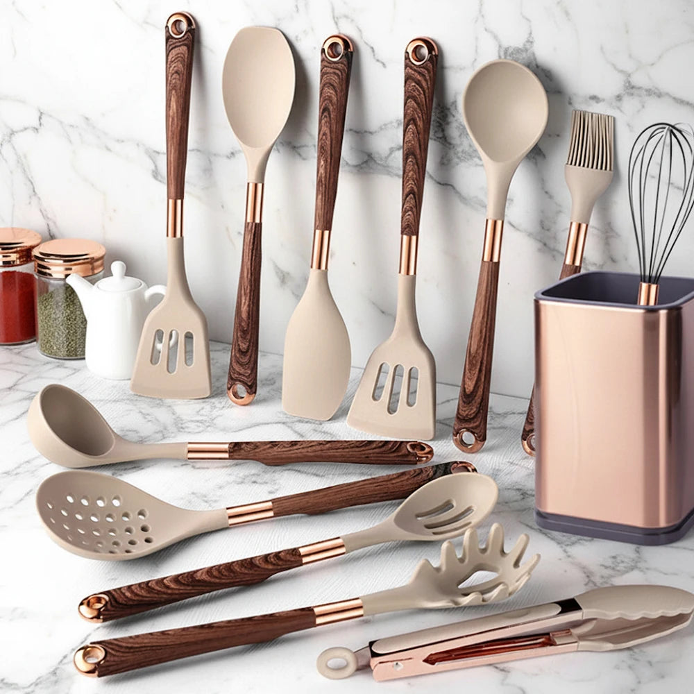 Beige silicone cooking utensil set with rose-gold handles and hanging looped tools