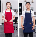 Red and navy waterproof canvas chef aprons with front pockets and buttoned straps