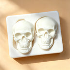 Halloween skull silicone cake mold tray showing two filled skull shapes