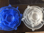 Two reusable silicone stretch lid sets, blue and white circular lids with pull tabs