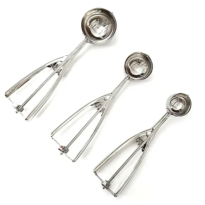Three stainless steel spring scoops with round bowls and spring-release handles