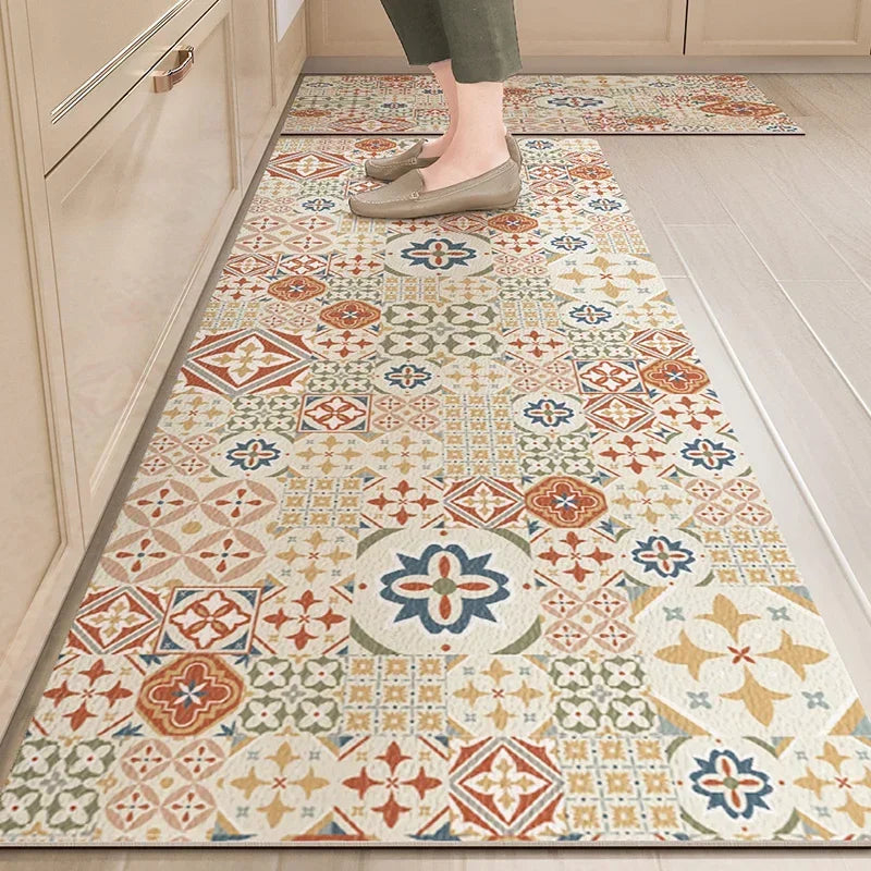 PVC kitchen floor mat with cream and multicolor Moroccan tile patchwork pattern.