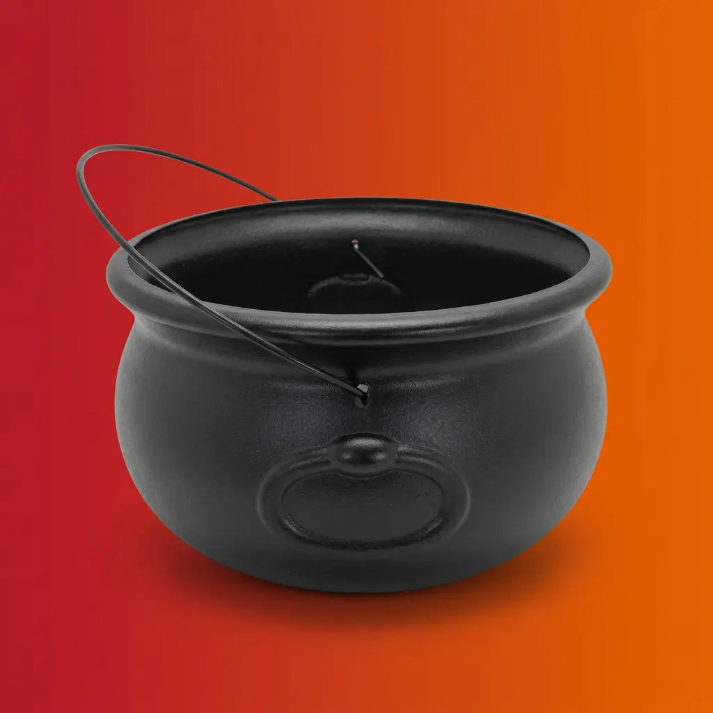 Black plastic Halloween cauldron with lid and wire handle on orange-red gradient background.