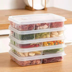 Multi-compartment clear refrigerator food storage box with stacked lids and divided sections