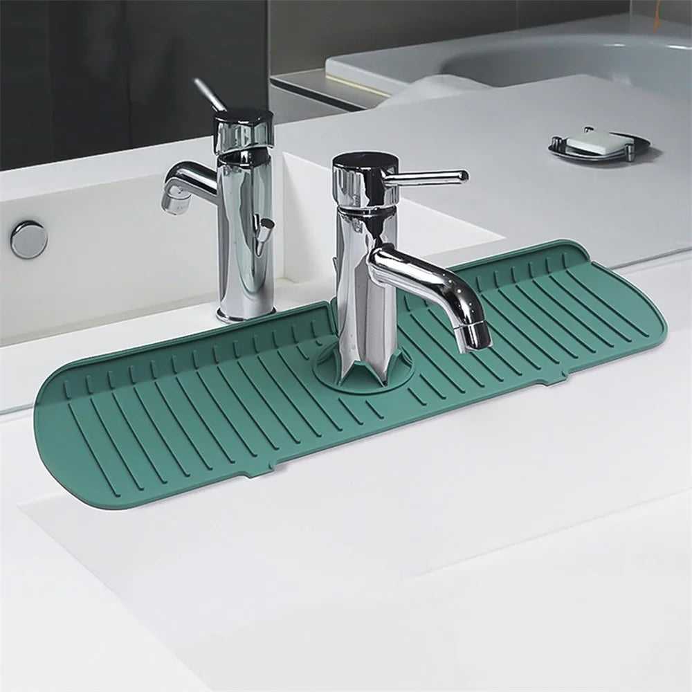 Green silicone sink splash guard and drain mat with ridged surface along sink edge